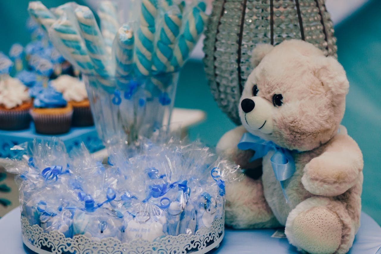 Charming setup for a baby shower with blue decorations and treats.